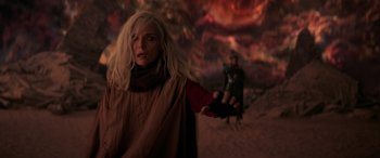 Movie still from “Ant-Man and the Wasp: Quantumania” (2023), directed by Peyton Reed – A woman holding out her hand in front of a man in the background; Medium shot, Over the shoulder angle