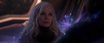 Movie still from “Ant-Man and the Wasp: Quantumania” (2023), directed by Peyton Reed – A woman with long white blonde hair looking to her left; Close Up shot, Over the shoulder angle