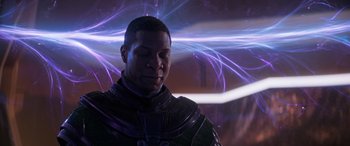 Movie still from “Ant-Man and the Wasp: Quantumania” (2023), directed by Peyton Reed – A man in a black outfit is looking down; Close Up shot, Over the shoulder angle