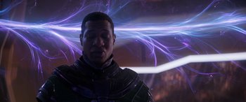 Movie still from “Ant-Man and the Wasp: Quantumania” (2023), directed by Peyton Reed – A black man in a purple and black outfit; Medium shot, Over the shoulder angle