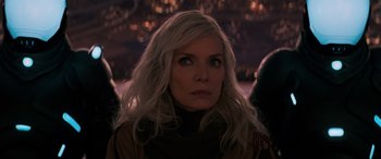 Movie still from “Ant-Man and the Wasp: Quantumania” (2023), directed by Peyton Reed – A woman with long white hair is looking into the distance; Close Up shot, Over the shoulder angle