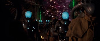 Movie still from “Ant-Man and the Wasp: Quantumania” (2023), directed by Peyton Reed – A group of people in space suits and helmets; Medium shot, Over the shoulder angle
