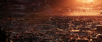 Movie still from “Ant-Man and the Wasp: Quantumania” (2023), directed by Peyton Reed – An aerial view of a large city at night; Extreme Wide shot, High angle