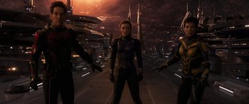 Movie still from “Ant-Man and the Wasp: Quantumania” (2023), directed by Peyton Reed – A woman standing on a street in front of a city; Medium shot, Low angle