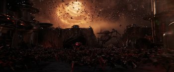 Movie still from “Ant-Man and the Wasp: Quantumania” (2023), directed by Peyton Reed – A crowd of people are gathered in the dark; Extreme Wide shot, High angle