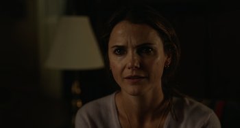 Movie still from “Antlers” (2021), directed by Scott Cooper – A person wearing a white shirt; Close Up shot, Over the shoulder angle