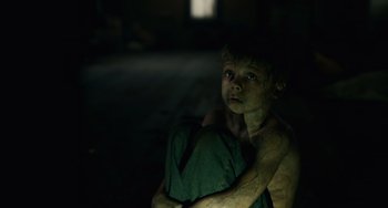 Movie still from “Antlers” (2021), directed by Scott Cooper – Medium shot, High angle