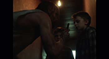 Movie still from “Antlers” (2021), directed by Scott Cooper – Medium shot, Over the shoulder angle