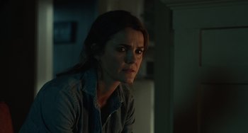 Movie still from “Antlers” (2021), directed by Scott Cooper – A person sitting in front of a window; Close Up shot, Over the shoulder angle