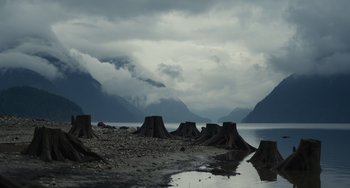 Movie still from “Antlers” (2021), directed by Scott Cooper – A body of water near a body of water; Extreme Wide shot, Low angle