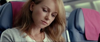 Movie still from “The Impossible” (2012), directed by J.A. Bayona – A person with long blonde hair; Close Up shot, Over the shoulder angle
