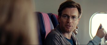 Movie still from “The Impossible” (2012), directed by J.A. Bayona – A person sitting in a chair; Close Up shot, Over the shoulder angle