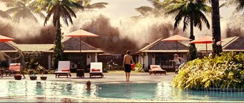 Movie still from “The Impossible” (2012), directed by J.A. Bayona – A man standing next to a swimming pool; Extreme Wide shot, Over the shoulder angle