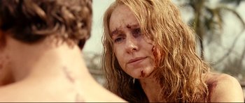 Movie still from “The Impossible” (2012), directed by J.A. Bayona – A person with wet hair looking at the camera; Close Up shot, Over the shoulder angle