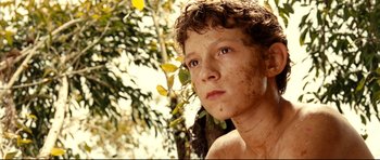 Movie still from “The Impossible” (2012), directed by J.A. Bayona – A young boy is looking into the distance; Close Up shot, High angle