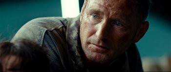 Movie still from “The Impossible” (2012), directed by J.A. Bayona – A person with blue eyes; Close Up shot, Over the shoulder angle