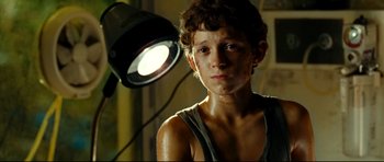 Movie still from “The Impossible” (2012), directed by J.A. Bayona – A young boy is standing in front of a light; Close Up shot, Low angle