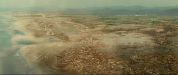 Movie still from “The Impossible” (2012), directed by J.A. Bayona – An aerial view of a large area of land; Extreme Wide shot, High angle