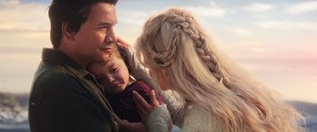 Movie still from “Aquaman” (2018), directed by James Wan – A man and a woman holding a little girl in her arms; Close Up shot, Over the shoulder angle