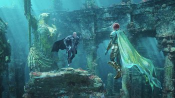 Movie still from “Aquaman” (2018), directed by James Wan – A man and a woman are swimming in the water; Wide shot, Low angle