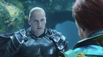 Movie still from “Aquaman” (2018), directed by James Wan – A man in armor is looking at another man in scuba gear; Close Up shot, Over the shoulder angle