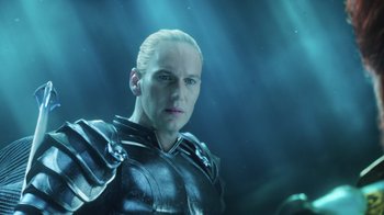 Movie still from “Aquaman” (2018), directed by James Wan – A person wearing a suit of armor; Close Up shot, Low angle