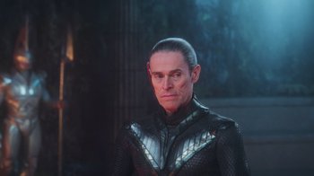 Movie still from “Aquaman” (2018), directed by James Wan – A man in a black and silver costume; Close Up shot, Over the shoulder angle