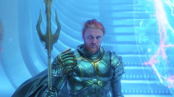 Movie still from “Aquaman” (2018), directed by James Wan – A man with a red beard holding a golden trident; Medium shot, Over the shoulder angle