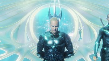 Movie still from “Aquaman” (2018), directed by James Wan – An image of a man in a suit of aquaman; Medium shot, High angle