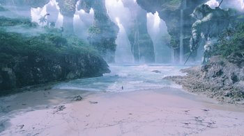 Movie still from “Aquaman” (2018), directed by James Wan – A view of a body of water with a waterfall in the background; Extreme Wide shot, High angle