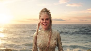 Movie still from “Aquaman” (2018), directed by James Wan – A woman with long blonde hair wearing a tiara; Close Up shot, Over the shoulder angle