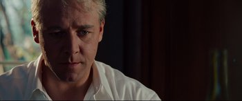 Movie still from “The Insider” (1999), directed by Michael Mann – A person wearing a white shirt; Close Up shot, Low angle
