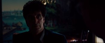 Movie still from “The Insider” (1999), directed by Michael Mann – A person wearing a suit and tie; Close Up shot, Over the shoulder angle