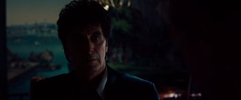 Movie still from “The Insider” (1999), directed by Michael Mann – A person wearing a suit and tie; Close Up shot, Over the shoulder angle