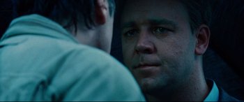 Movie still from “The Insider” (1999), directed by Michael Mann – A man's face as he looks into the mirror; Close Up shot, Over the shoulder angle