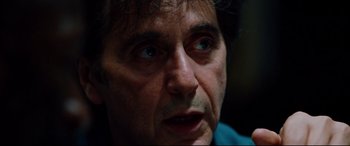 Movie still from “The Insider” (1999), directed by Michael Mann – A man's face looking into the distance; Close Up shot, Over the shoulder angle