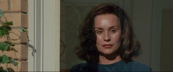 Movie still from “The Insider” (1999), directed by Michael Mann – A person wearing a blue shirt; Close Up shot, High angle