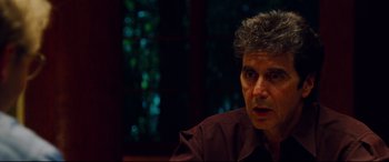 Movie still from “The Insider” (1999), directed by Michael Mann – A person sitting in a room; Close Up shot, Over the shoulder angle