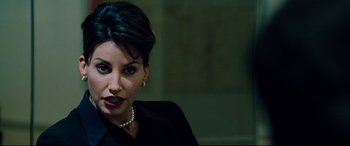 Movie still from “The Insider” (1999), directed by Michael Mann – A person wearing a black shirt; Close Up shot, Over the shoulder angle