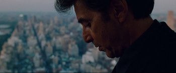 Movie still from “The Insider” (1999), directed by Michael Mann – A person looking down at a city skyline; Close Up shot, Low angle