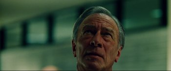 Movie still from “The Insider” (1999), directed by Michael Mann – An older man looking up into the sky; Close Up shot, Low angle