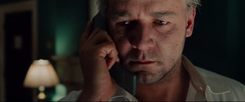 Movie still from “The Insider” (1999), directed by Michael Mann – A person talking on a cell phone; Close Up shot, Low angle