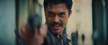 A person holding a gun in his hand