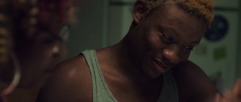 A person with a green tank top on