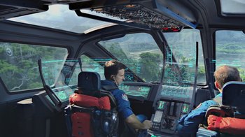 Movie still from “Avatar” (2009), directed by James Cameron – A man in the cockpit of an airplane; Wide shot, High angle