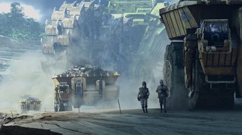 Movie still from “Avatar” (2009), directed by James Cameron – Two men in protective suits walking down a street; Extreme Wide shot, Low angle