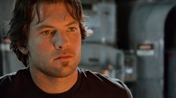 Movie still from “Avatar” (2009), directed by James Cameron – A person wearing a black t - shirt; Close Up shot, Low angle