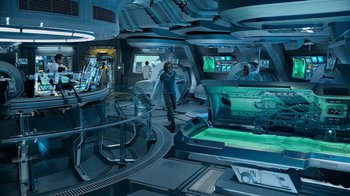 Movie still from “Avatar” (2009), directed by James Cameron – Some people are in a room with a spaceship; Wide shot, High angle
