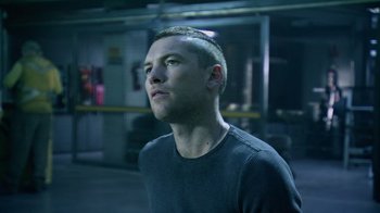 Movie still from “Avatar” (2009), directed by James Cameron – A man with a shaved head looking up at the sky; Close Up shot, Low angle