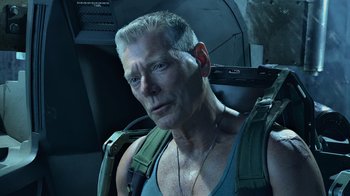 Movie still from “Avatar” (2009), directed by James Cameron – A person wearing a backpack; Close Up shot, Low angle